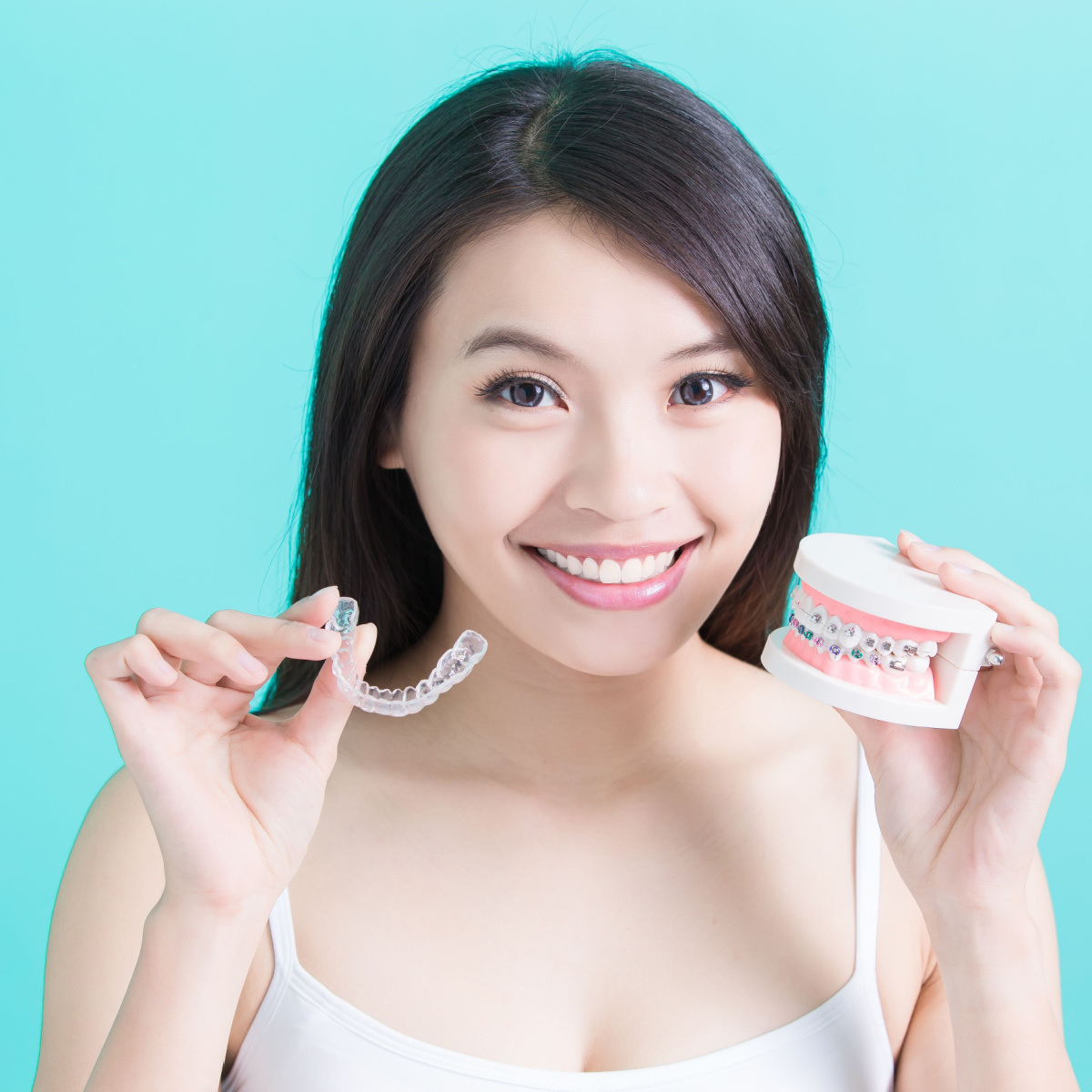 How Our Houston Dentist Decides if Invisalign or Dental Braces Are Right for You