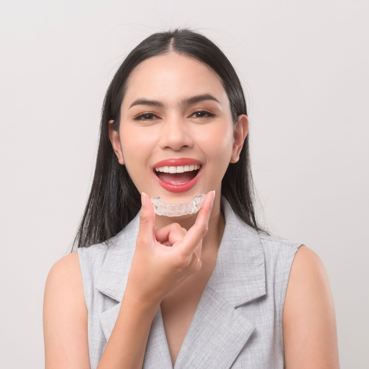 Lady comfortably shows off her Houston Invisalign.