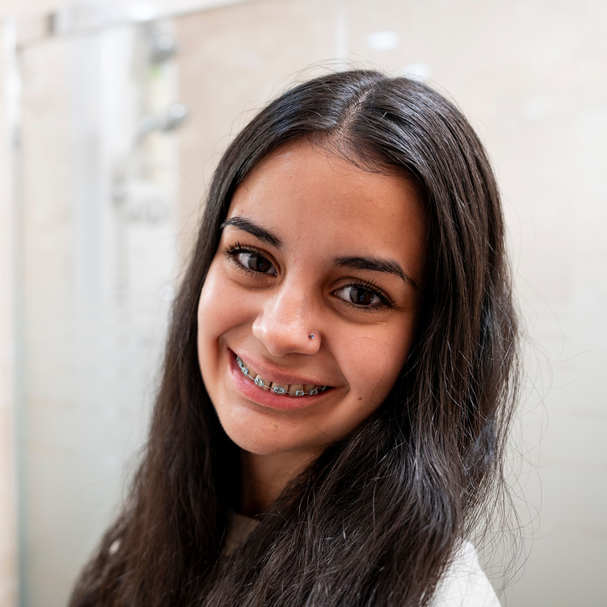 Experience this girl’s confidence with a Houston braces treatment.