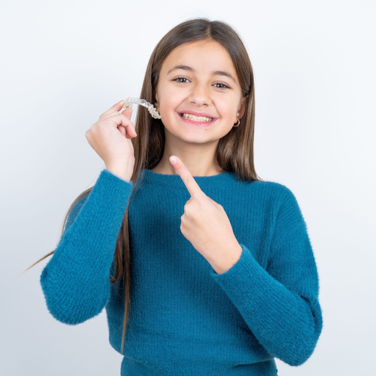 A child holding Houston Invisalign